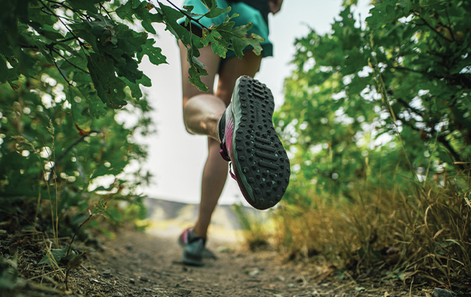 Shoe showing advanced traction system for enhanced trail performance